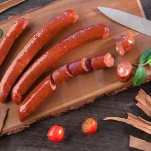 carrots and green chili on brown wooden chopping board